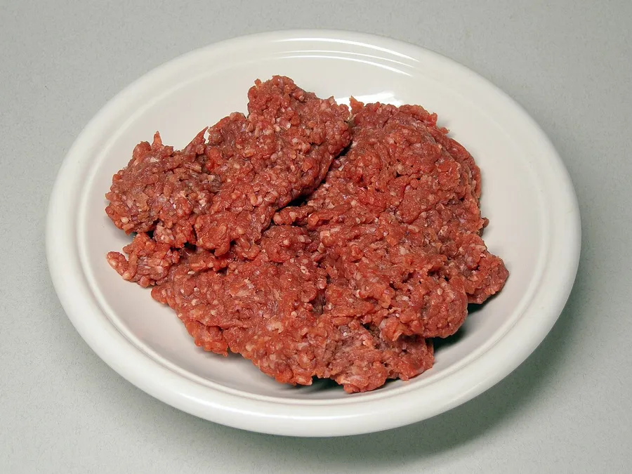 Freshly ground beef on a white plate.