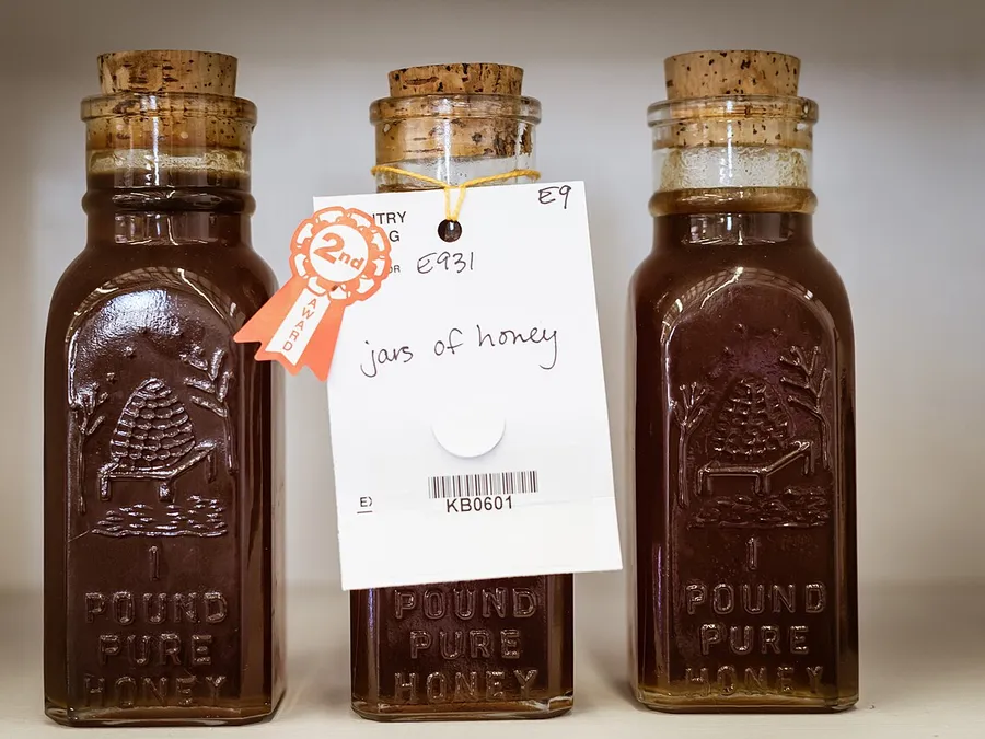 Amber honey in glass jars.