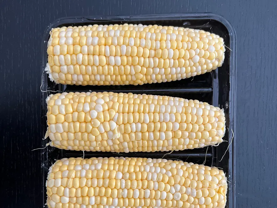 Freshly husked ears of sweet corn.