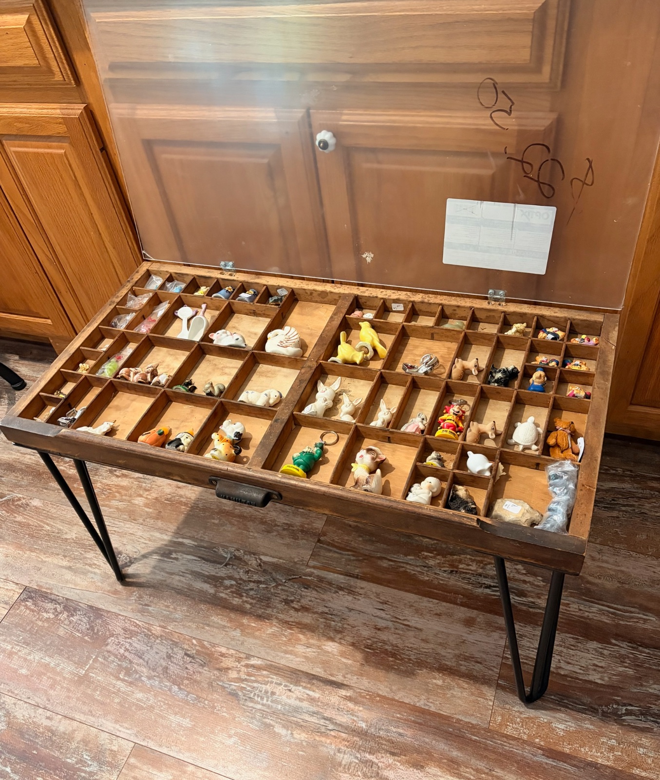 Vintage printers drawer with hairpin legs and plexiglass lid to protect your treasures from dust.
