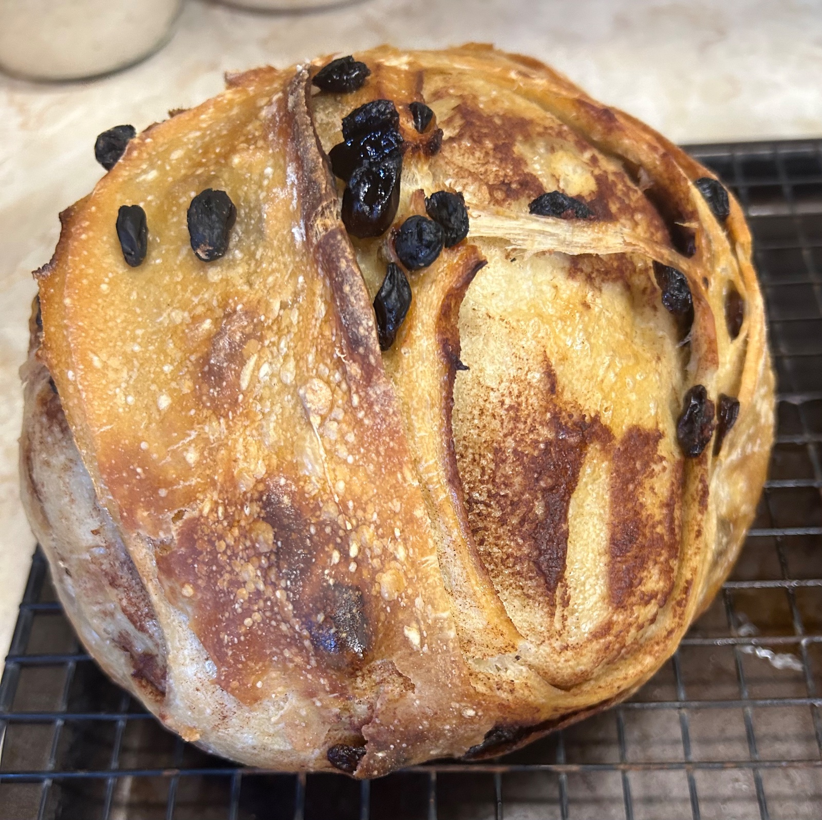 Cinnamon Raisin Sourdough bread on cooling rack